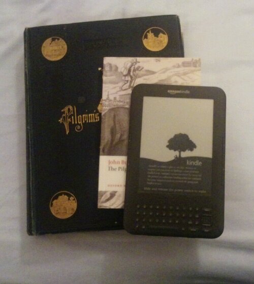 Image of hardback copy pf Pilgrim's Progress, World Classics paperback and my Kindle